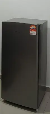 a black refrigerator with a red sticker on it at D'NAS HOMESTAY - Muslm Only in Sungai Besar