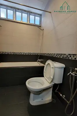a bathroom with a toilet and a bath tub at 99 Kelawei in George Town