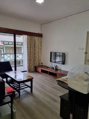a living room with a couch and a table at Copthorn Homestay in Brinchang