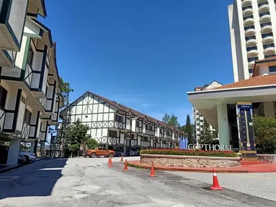 a city street with orange cones in front of buildings at Copthorn Homestay in Brinchang