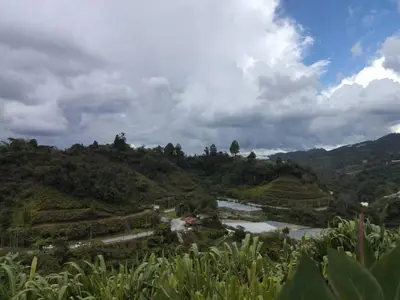 a view of a valley with a river and mountains at Glamz Hills in Cameron Highlands