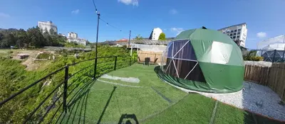 a green dome tent on top of a building at Glamz Hills in Cameron Highlands