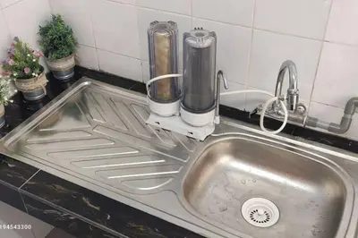 a sink in a kitchen with a sinkyss at Margosa Botani Ipoh Homestay 3BR by Grab A Stay in Ipoh