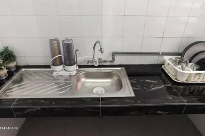 a stainless steel sink in a kitchen at Margosa Botani Ipoh Homestay 3BR by Grab A Stay in Ipoh