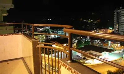 a view of a city at night from a balcony at Crown Imperial Court Apartment (Madam Ng)1 in Cameron Highlands