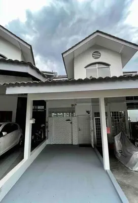 a white house with a car parked in the garage at Tanjung Bungah PEARL HILL42 Homestay in Tanjung Bungah