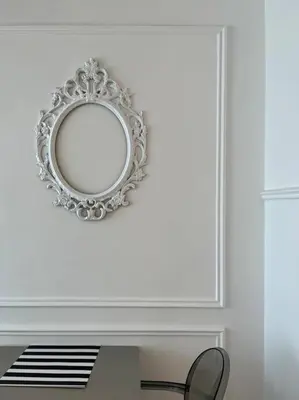 a mirror hanging on a wall above a table at Tanjung Bungah PEARL HILL42 Homestay in Tanjung Bungah