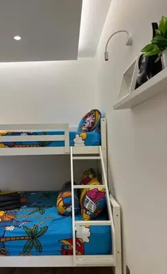 a bunk bed in a room with a bunk bedscribed at Tanjung Bungah PEARL HILL42 Homestay in Tanjung Bungah