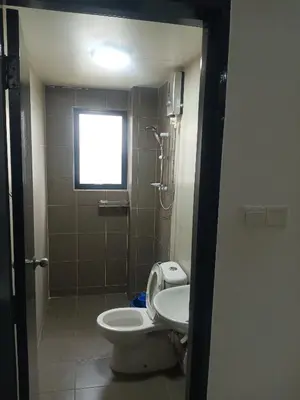 a bathroom with a toilet and a shower and a sink at Pangkor L29, Dream Island Homestay in Kampong Sungai Udang