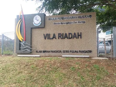 a sign for the vla raadalah sign in a park at Pangkor L29, Dream Island Homestay in Kampong Sungai Udang