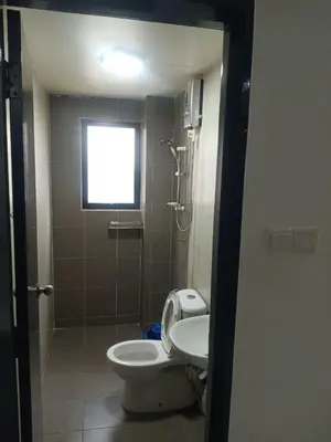 a bathroom with a toilet and a shower and a sink at Pangkor L29, Dream Island Homestay in Kampong Sungai Udang