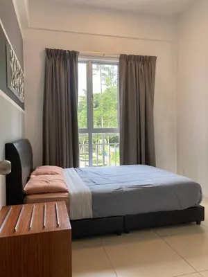 a bedroom with a bed and a window at Fazlia Resthouse at Golden Hills Cameron Highlands near pasar malam in Tanah Rata