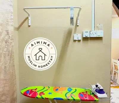 a surfboard sitting on a shelf in a room at Aimima Muslim Homestay @ Lost World Of Tambun. in Kampong Batu Lapan