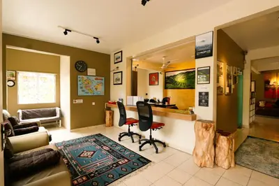 a living room with a couch and a table at Golden Lodge in Tanah Rata