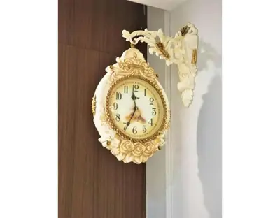 a gold clock is hanging on a wall at \u7687\u5bb6\u6d77\u666fROYAL Luxury Seaview Room, 3 minute to Gurney in Tanjong Tokong