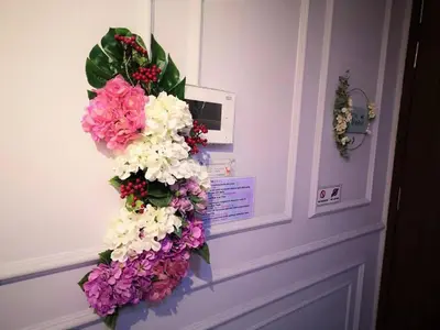 a door with a wreath of flowers on it at \u7687\u5bb6\u6d77\u666fROYAL Luxury Seaview Room, 3 minute to Gurney in Tanjong Tokong