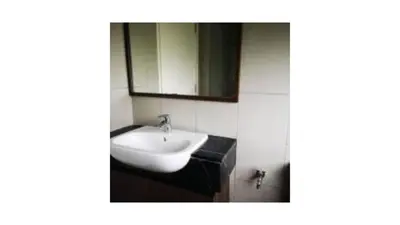 a bathroom with a sink and a mirror at Tree Family Executive Suite 3 BR /8 PAX Gurney in Tanjong Tokong