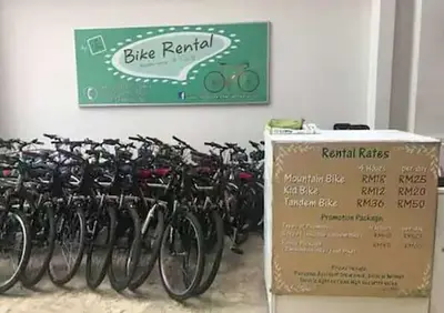 a bunch of bikes are lined up against a wall at WOW Strait Quay Luxury Suite Room in Tanjong Tokong