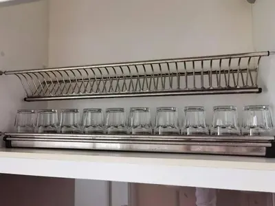 a row of empty glasses sitting on a shelf at SUMMERSET 8PAX 3BR LUXURY SEAVIEW SUITE ROOM in George Town