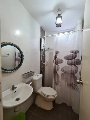 a bathroom with a toilet and a sink and a shower at Sekinchan PaddyCruise Homestay Wifi in Sekincan