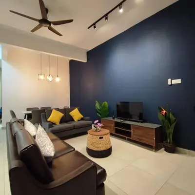 a living room with a couch and a flat screen tv at W39WarmStay@GoldenHills/NightMarket/4R/BBQ in Brinchang
