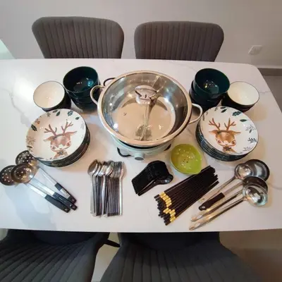 a table with plates and utensils on it at W39WarmStay@GoldenHills/NightMarket/4R/BBQ in Brinchang