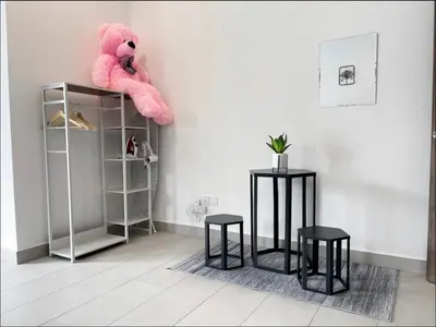 a pink teddy bear sitting on top of a shelf at New 2 storey-Majestic Homestay 3 min to Night Market in Brinchang