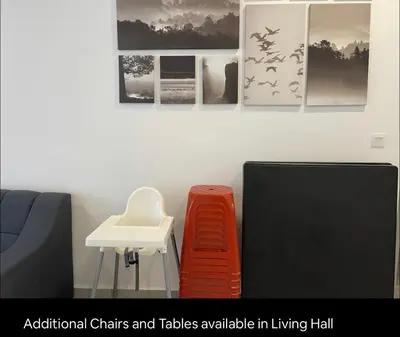 a waiting room with chairs and a table and a sink at New 2 storey-Majestic Homestay 3 min to Night Market in Brinchang