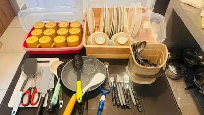 a kitchen counter with utensils and containers of food at New 2 storey-Majestic Homestay 3 min to Night Market in Brinchang
