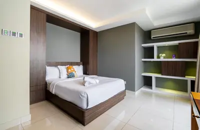 a bedroom with a bed and a television in it at Mansion One Executive Bathtub 1Bedroom 2-4pax in George Town