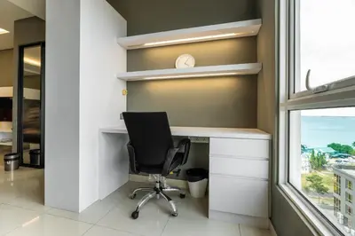 a desk with a chair in a room with a window at Mansion One Executive Bathtub 1Bedroom 2-4pax in George Town