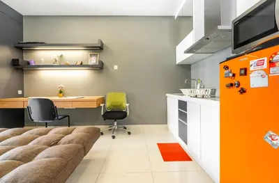 an office with a couch and a desk and chairs at Mansion One Executive Bathtub 1Bedroom 2-4pax in George Town