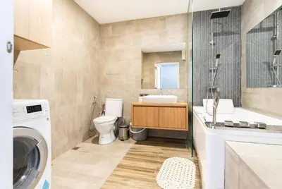 a bathroom with a sink and a washing machine at Mansion One Executive Bathtub 1Bedroom 2-4pax in George Town