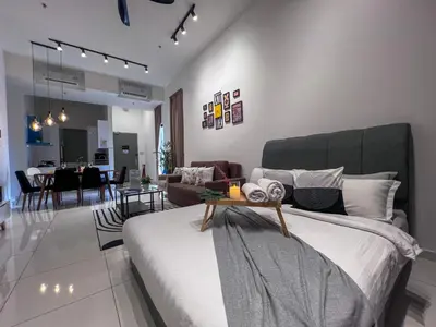a bedroom with a bed and a living room at Georgetown#Beacon Executive Suite SkyPool#Luxury&Glamorous Suite#2BR#Living Room with Queen Bed in George Town