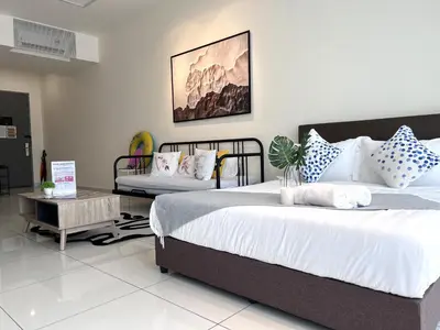 a bedroom with a large bed and a table at Georgetown#Beacon Executive Suite SkyPool#Luxury&Glamorous Suite#2BR#Living Room with Queen Bed in George Town