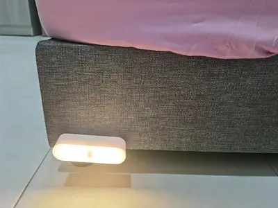 a brown couch with a light on the floor at My Homestay Sitiawan - Astronaut Space House 8 Pax in Sitiawan