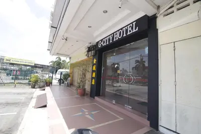 a store front of a store with a star on the sidewalk at G CITY HOTEL in Teluk Intan