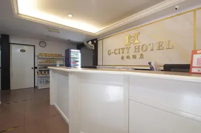 a lobby of a city hotel with a counter at G CITY HOTEL in Teluk Intan