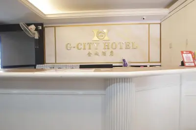 a sign for a city hotel on top of a counter at G CITY HOTEL in Teluk Intan