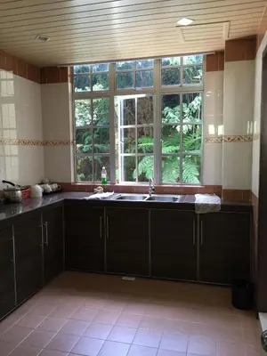 a kitchen with a sink and a window at Cameron Pasar Malam Apartment @ Crown Imperial Court in Cameron Highlands