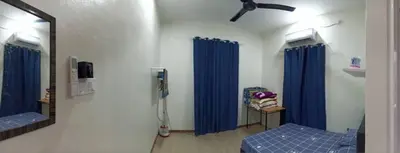 a hospital room with blue curtains and a mirror at Ainaz Homestay Balik Pulau in Balik Pulau