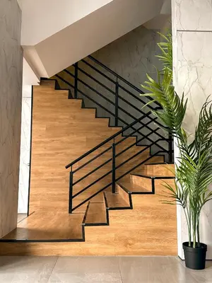 a staircase with black metal railings in a house at Hotel Brynton at Cameron Centrum Mall in Cameron Highlands