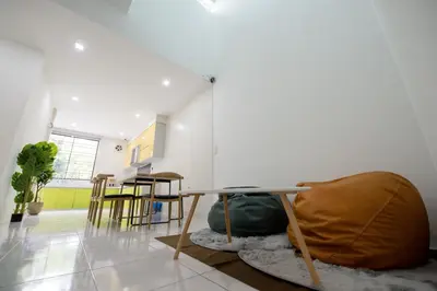 a living room with a table and chairs at De Luma Alma 9 bedroom with 8 bathroom in Bukit Mertajam