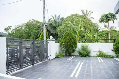 a balcony with a fence and trees at De Luma Alma 9 bedroom with 8 bathroom in Bukit Mertajam