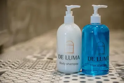 two bottles of detergent sitting next to each other at De Luma Alma 9 bedroom with 8 bathroom in Bukit Mertajam
