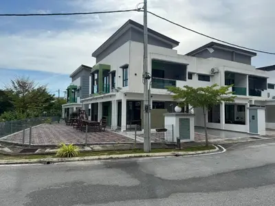 a large white house on the side of a street at Pangkor L30 88 Corner villa House in Pangkor