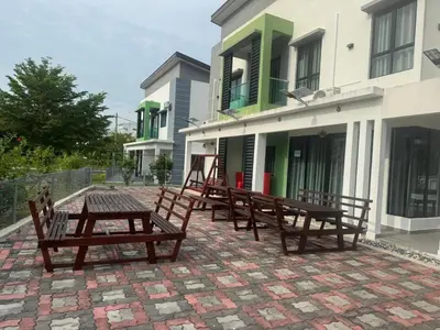 a group of benches sitting outside of a building at Pangkor L30 88 Corner villa House in Pangkor