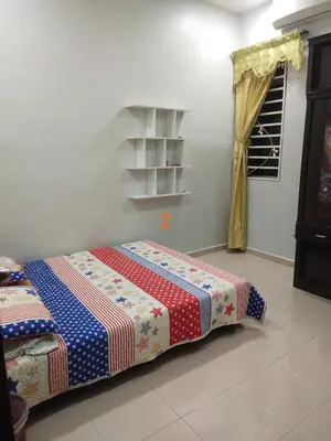 a bedroom with a bed in a room at Rumah Singgah in Pantai Remis