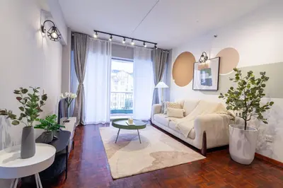 a living room with a couch and a table at Star Regency by Plush in Brinchang