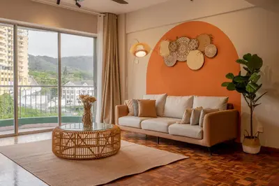 a living room with a couch and a table at Star Regency by Plush in Brinchang